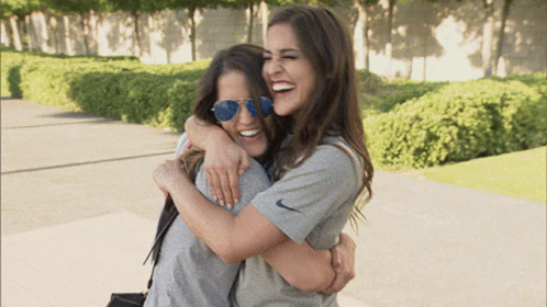 two girls hugging gif
