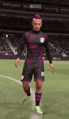 a soccer player with a pink mohawk and number 9 on his shorts