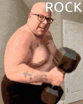 a shirtless man with glasses is lifting a dumbbell and the word rock is above him