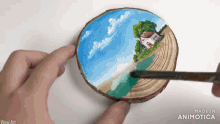 a person is painting a picture on a piece of wood which says wow art on the bottom