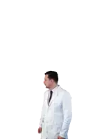 a man wearing a white lab coat and black tie looks surprised