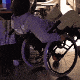 a person in a wheelchair is wearing a hoodie that says dickies on it