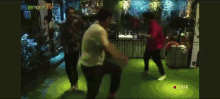 a group of people are dancing in front of a sign that says " before tv "