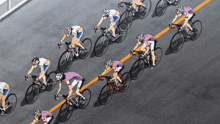 a group of people are riding bicycles on a street