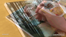 a video of a person painting with the words made in animatica on the bottom right