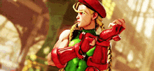 cammy from street fighter is wearing a red beret and gloves .