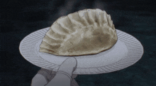 a person is holding a paper plate with a bread on it