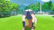 a girl in a school uniform is doing a handstand in a park with trees in the background
