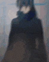 a blurry picture of a person wearing a scarf around their neck