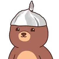 a brown bear wearing a silver hat with a horn on it