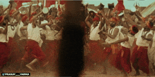 a group of people are dancing with the words pranay varma on the bottom right