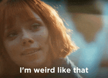 a close up of a woman 's face with the words i 'm weird like that above her