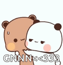 a couple of bears are standing next to each other .