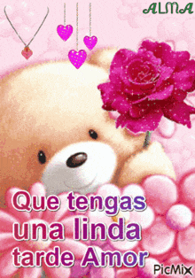a teddy bear holding a pink rose with the words que tengas una linda tarde amor on the bottom