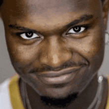 a close up of a man 's face making a funny face