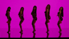 a group of women are dancing in front of a pink background