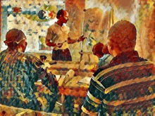 a man is giving a presentation to a group of people in a classroom .