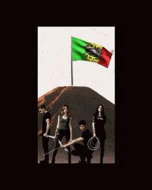 a group of people are standing in front of a flag that says one love