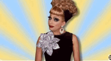 a drag queen wearing a wig and earrings is making a face .
