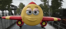 a cartoon airplane with a yellow face on it