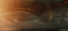 a scene from the movie godzilla shows a giant monster flying through the air .