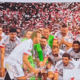 a group of soccer players are posing for a picture and one of them has the number 40 on his jersey