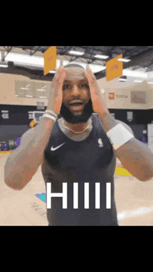 a basketball player is making a funny face with his hands on his head