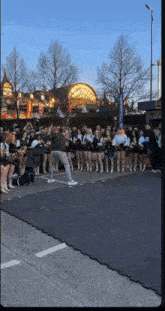 a group of cheerleaders are standing in front of a building that says aurora mall