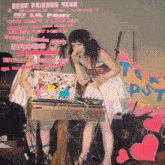 two girls are sitting at a desk with a laptop and a sign that says " best friends 4eva "