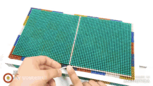a person is holding a piece of colored beads with the words " diy wonderful " on the bottom