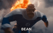 a man in a superhero costume is running with a fireball behind him and the word bean is visible .