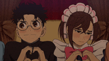a boy and a girl making a heart with their hands