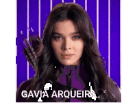 a woman in a purple costume with a bow and arrow .
