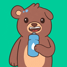a brown teddy bear is holding a blue can of soda in its mouth