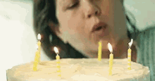 Girl Blowing Candles GIF
