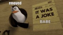 a penguin from madagascar is standing next to a piece of paper that says `` it was a joke babe '' .