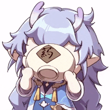 a cartoon character with horns is drinking from a cup with chinese writing on it .