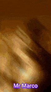 a blurred image of a person with the name mr marco on it