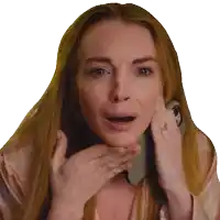 a woman with long red hair is talking on a cell phone