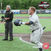 a baseball player with the number 28 on his jersey is running on a field