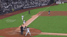 a baseball player with the number 35 on his back is sliding into home plate