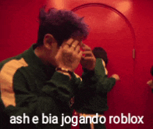 ash e bia jogando roblox is written on a picture of a man