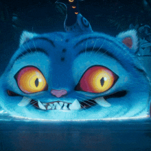 a close up of a blue cartoon cat with orange eyes