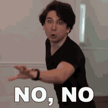 a man in a black shirt is making a funny face with the words no on the bottom