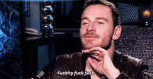 a man with a beard is saying fuckity fuck fuck