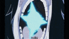 a close up of a person 's mouth with a blue star in it .