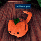 a stuffed orange cat with a green leaf on its head has a blue sign that says i will break you on it