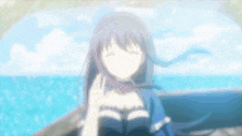 a blurry picture of a girl standing in front of a body of water .