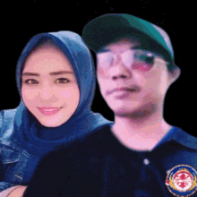 a man and a woman are posing for a picture and the woman is wearing a blue head scarf