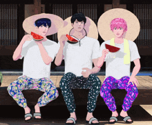 three young men are eating watermelon and wearing hats